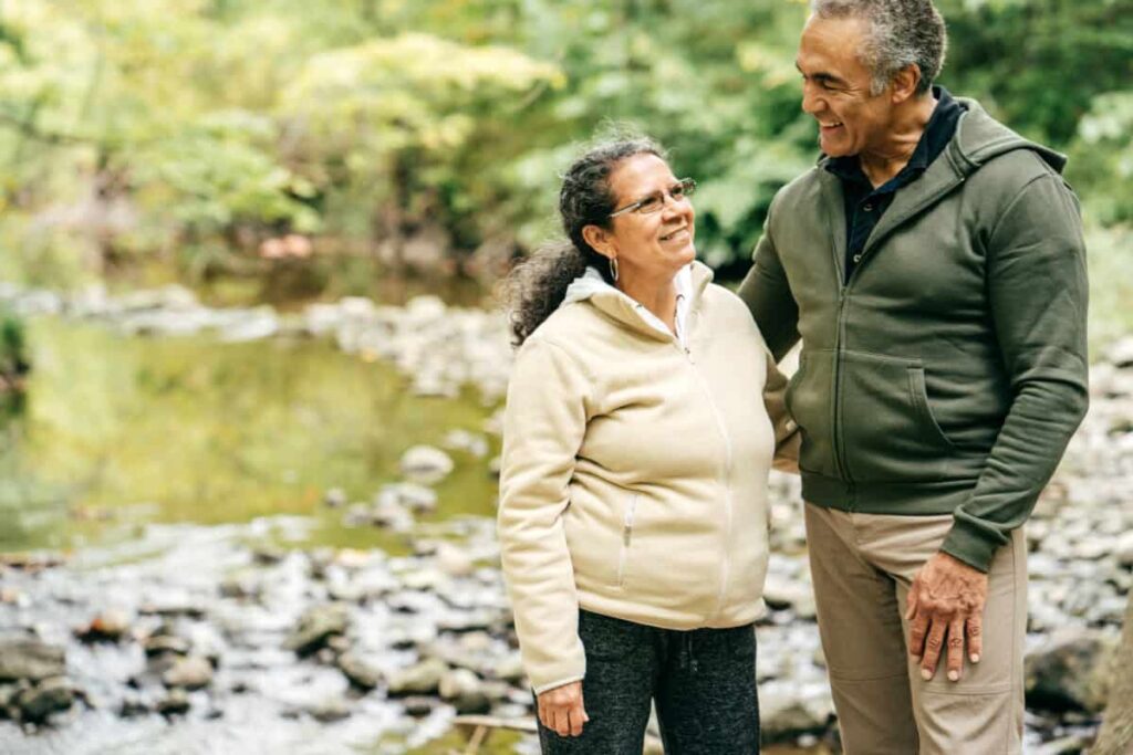 TFSA Investing: How Couples Can Earn an Average of $772 per Month Tax-Free Two seniors walk in the forest