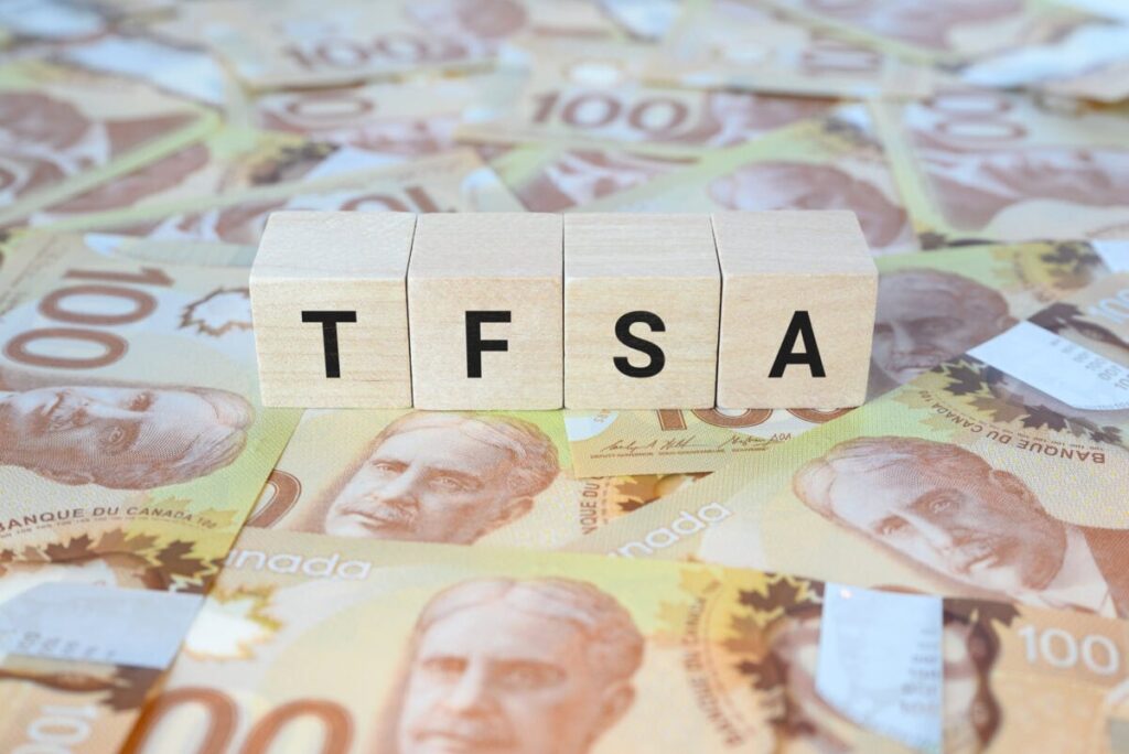 I’d Put a Big Slice of My TFSA Into This 5.1% Dividend Stock TFSA (Tax-Free Savings Account) on wooden blocks and Canadian one hundred dollar bills.